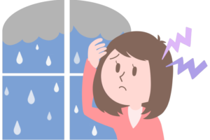 雨と頭痛女性